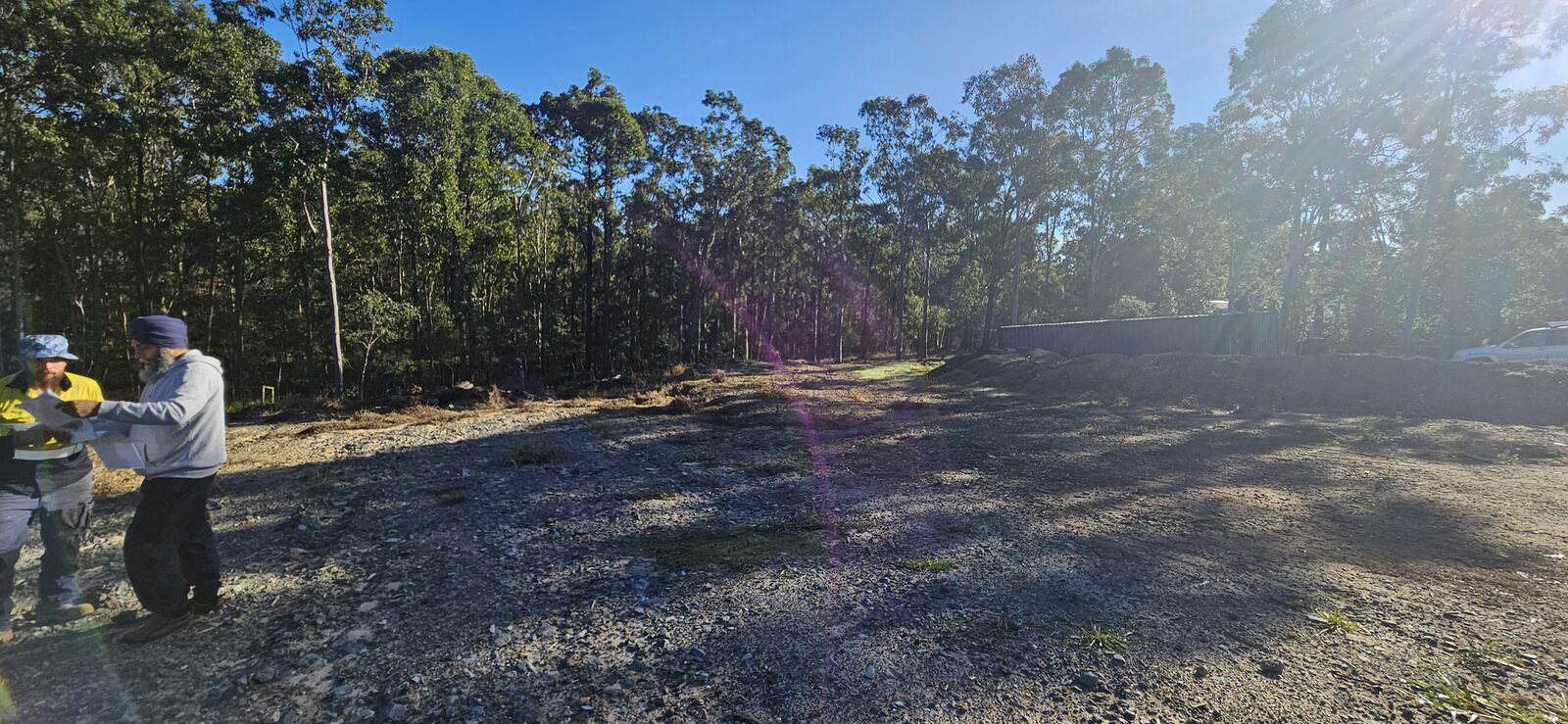The large cleared block backing onto bushland, ready to be marked out for the new family home