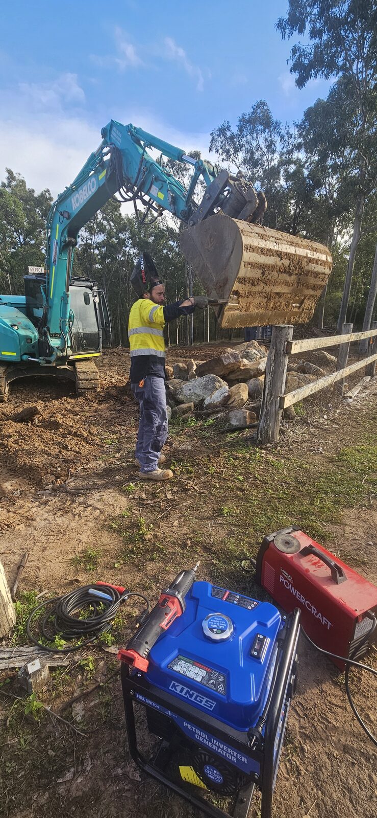 Sollid Solutions worker repairing the excavator bucket on site