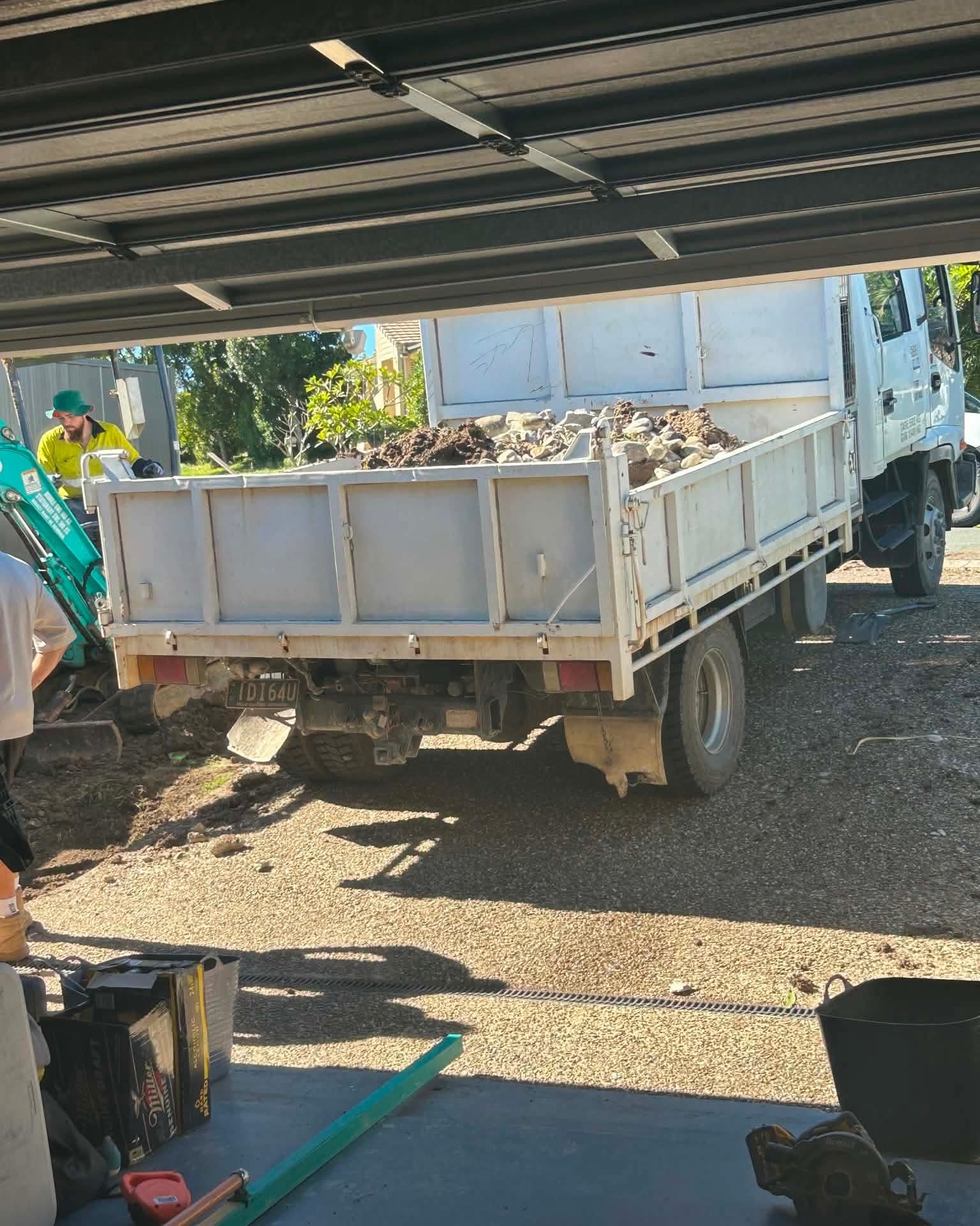 Tipper loaded with spoil on an excavator and tipper combo hire in Ormeau